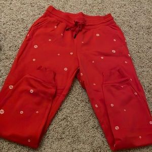 never worn, brand is old navy, color is red with white daisys